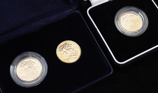 A cased pair of Royal Mint 2000 gold full sovereigns and a cased 2005 gold full sovereign,